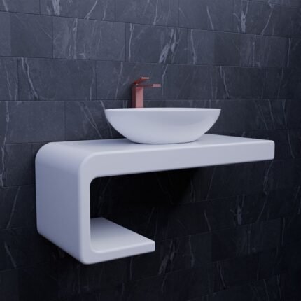 Sleek white bathroom sink with a minimalist design against dark tiles, featuring a modern faucet.